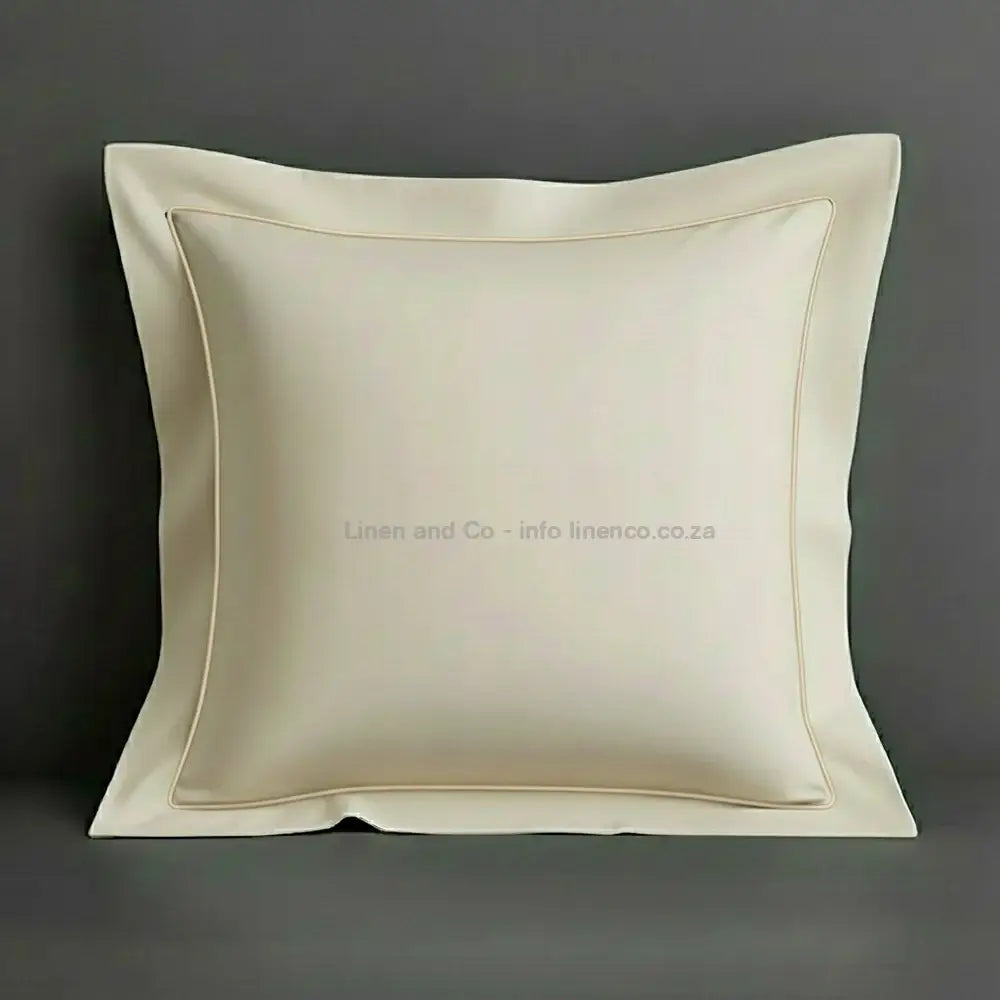 White continental oxford pillow case with cream one row satin stitch detail on a grey background. Luxury Hotel Linen by Linen and Co.