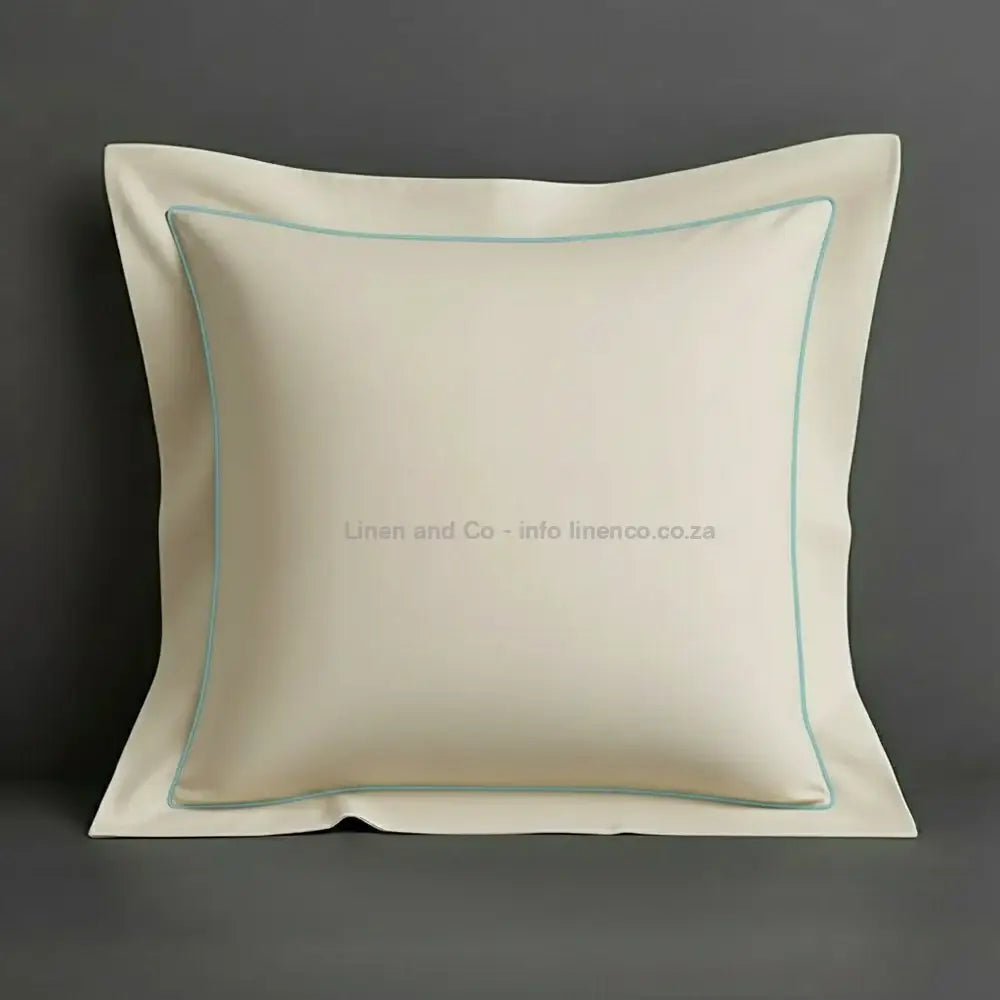 White continental oxford pillow case with duck egg one row satin stitch detail on a grey background. Luxury Hotel Linen by Linen and Co.