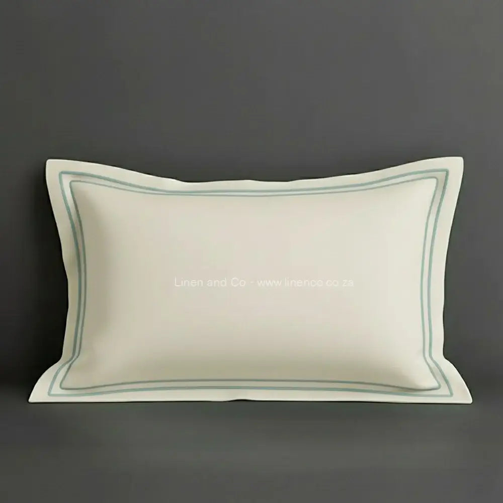 Cream oxford pillow case with duck egg two row satin stitch detail on a grey background. Luxury Hotel Linen by Linen and Co.