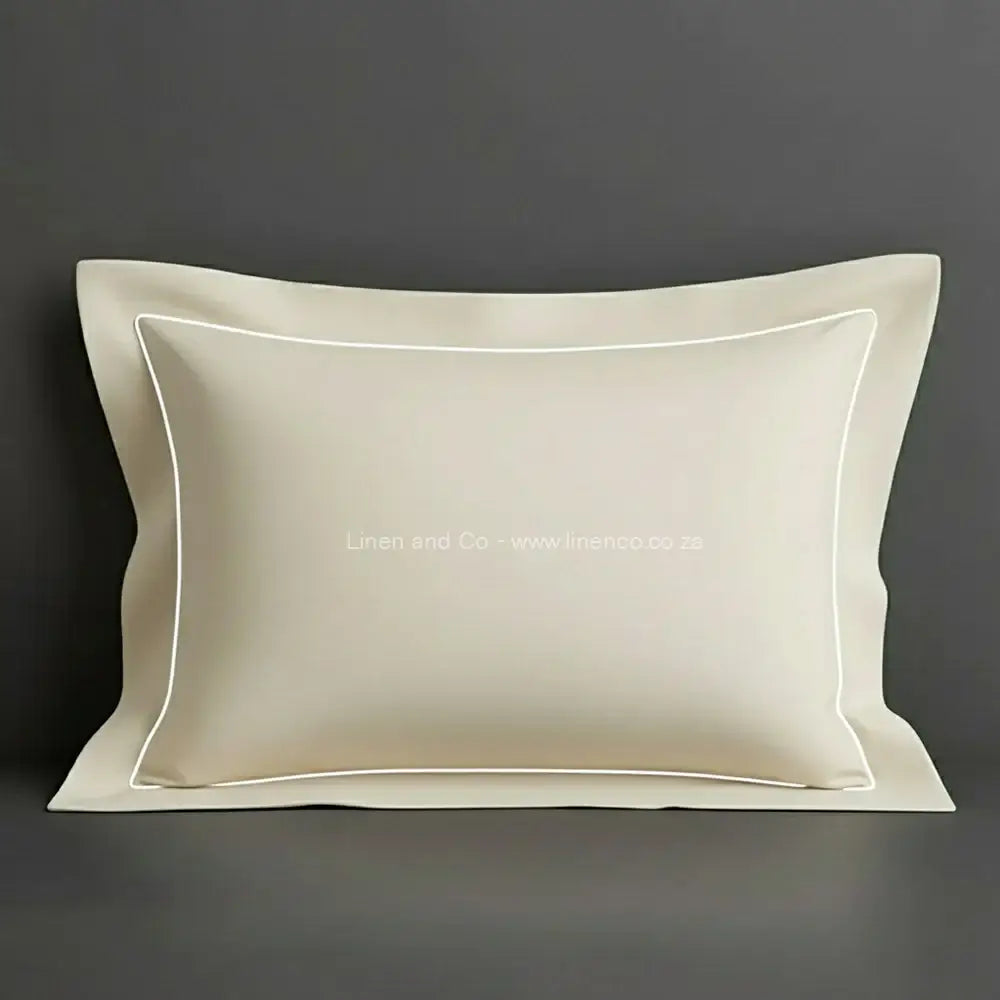 Cream oxford pillow case with White one row satin stitch detail on a grey background. Luxury Hotel Linen by Linen and Co.