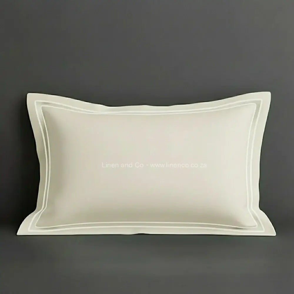 Cream oxford pillow case with white two row satin stitch detail on a grey background. Luxury Hotel Linen by Linen and Co.