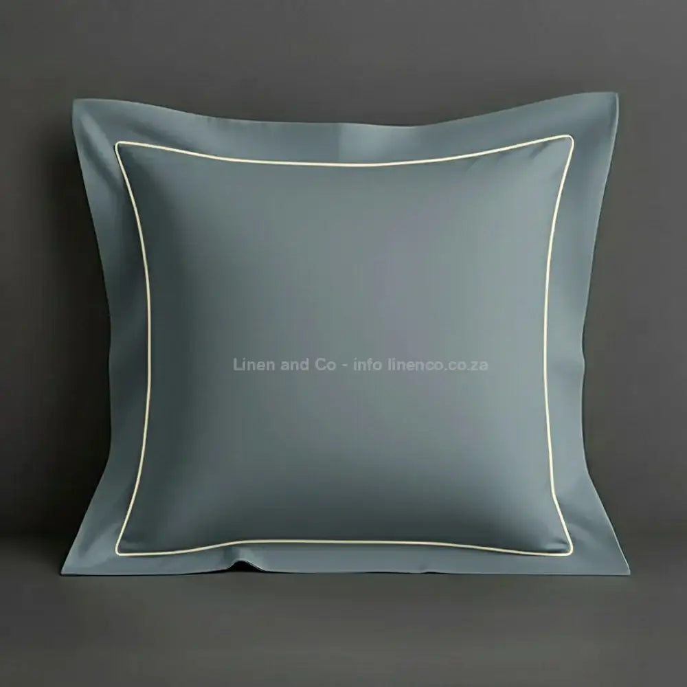 Duck Egg continental oxford pillow case with cream one row satin stitch detail on a grey background. Luxury Hotel Linen by Linen and Co.