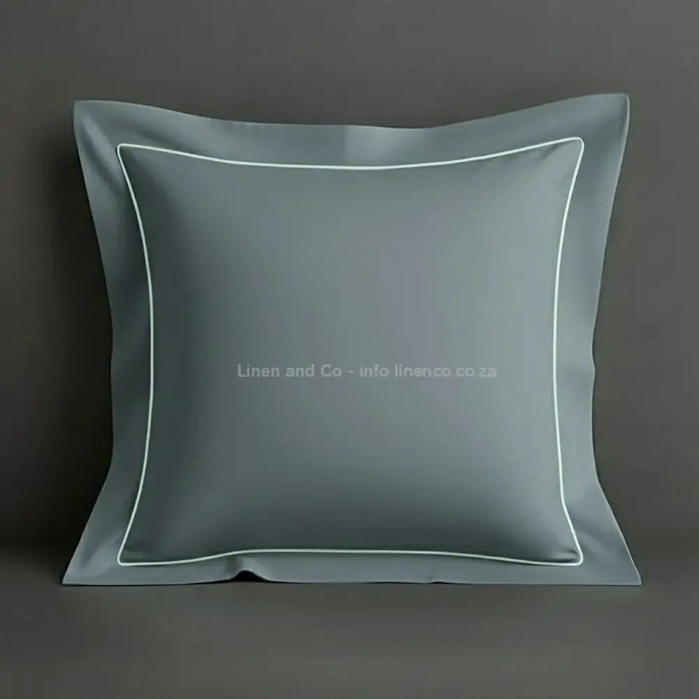 Duck Egg continental oxford pillow case with duck egg one row satin stitch detail on a grey background. Luxury Hotel Linen by Linen and Co.