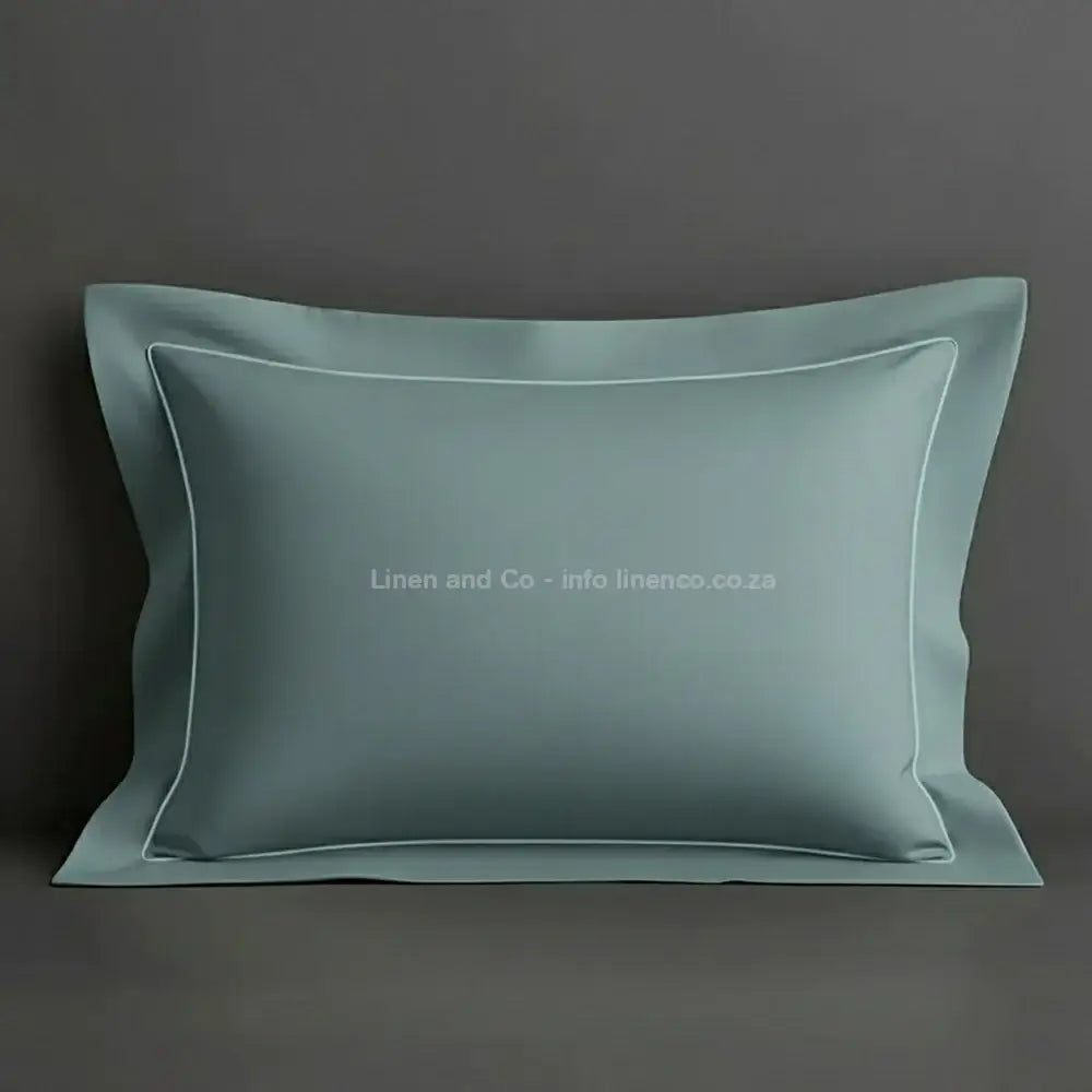 Duck Egg oxford pillow case with duck egg one row satin stitch detail on a grey background. Luxury Hotel Linen by Linen and Co.