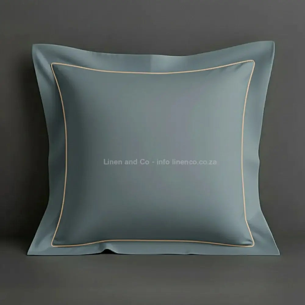 Duck Egg continental oxford pillow case with stone one row satin stitch detail on a grey background. Luxury Hotel Linen by Linen and Co.