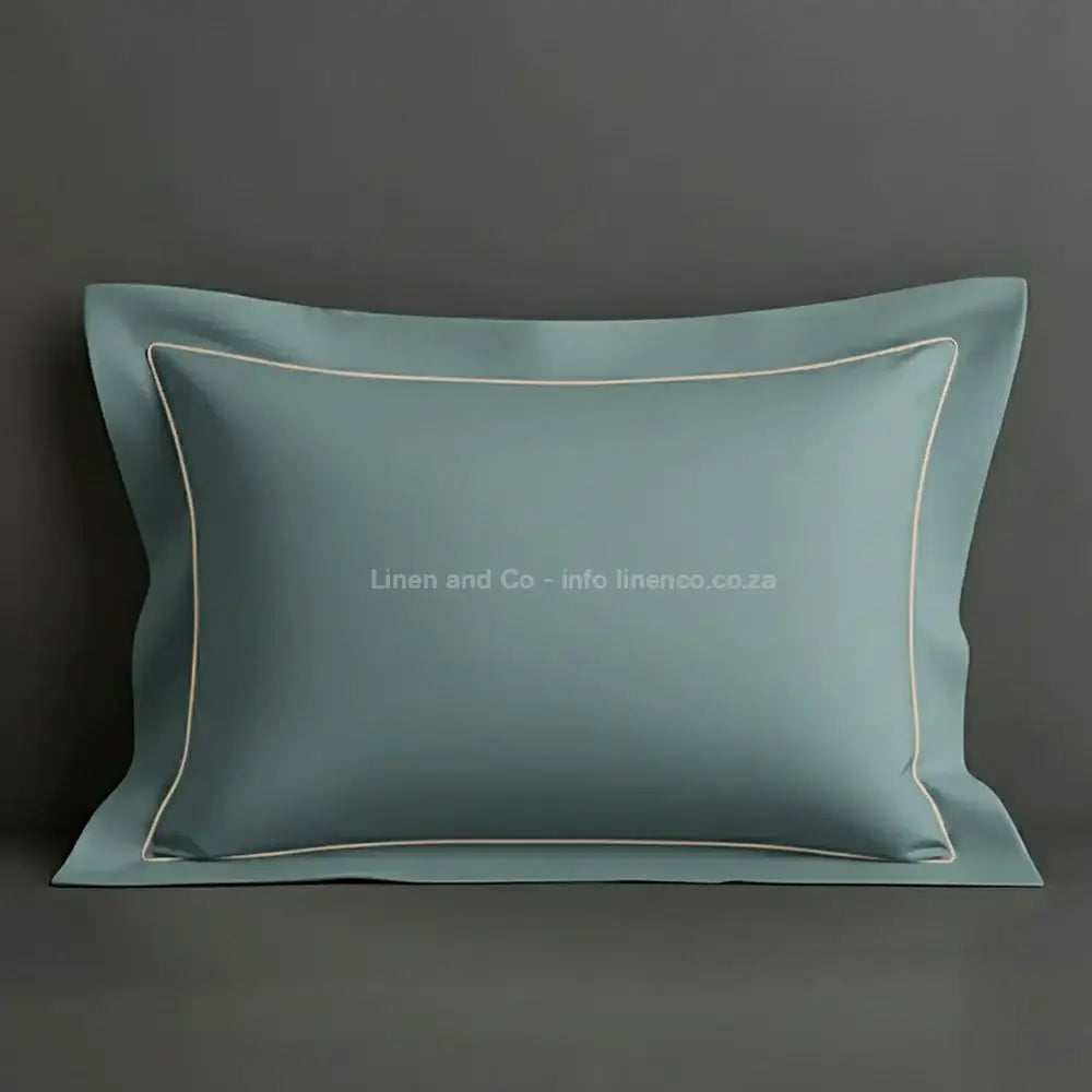Duck Egg oxford pillow case with stone one row satin stitch detail on a grey background. Luxury Hotel Linen by Linen and Co.