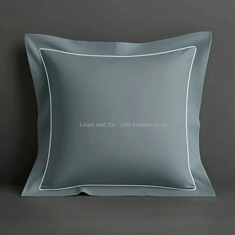 Duck Egg continental oxford pillow case with white one row satin stitch detail on a grey background. Luxury Hotel Linen by Linen and Co.