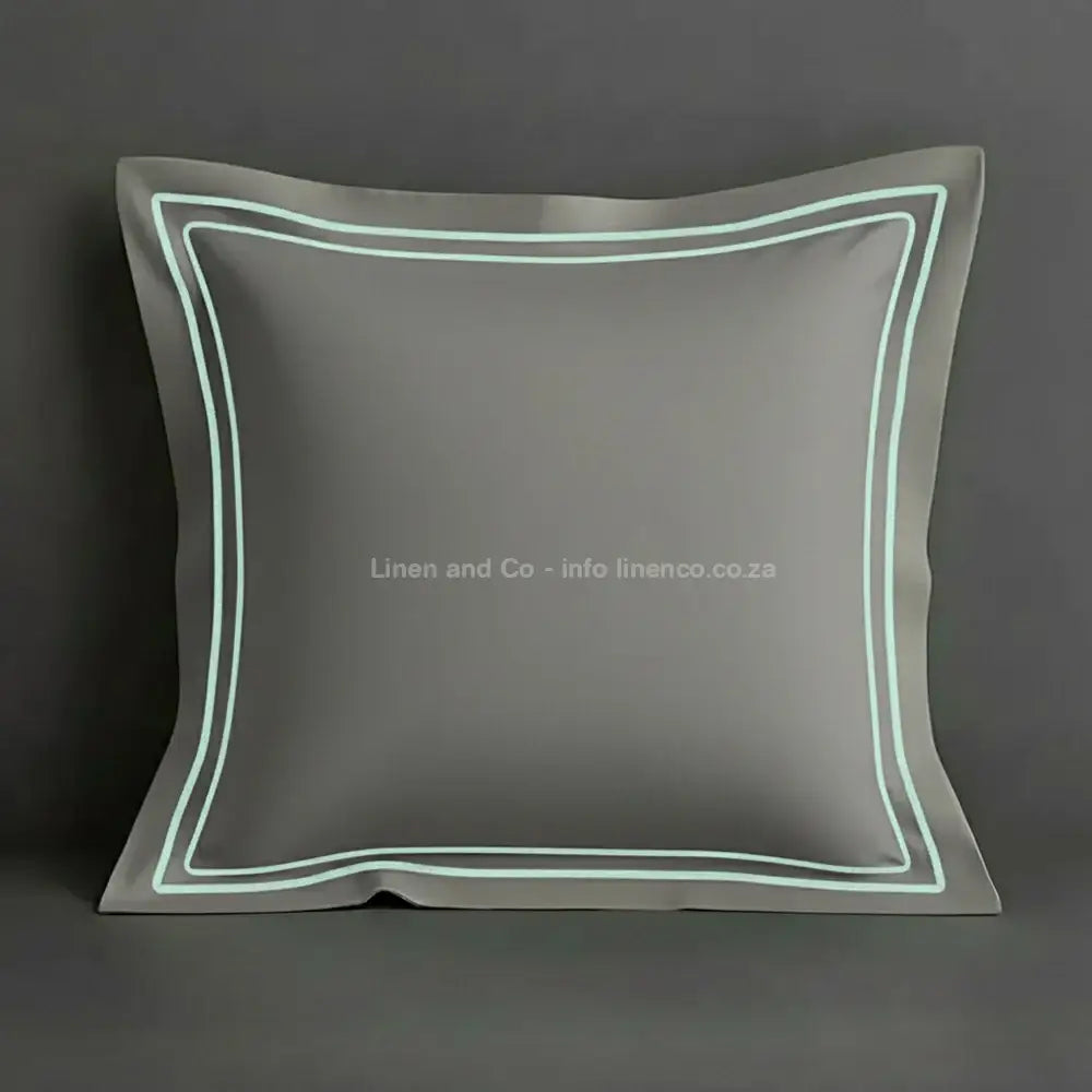 Grey continental oxford pillow case with duck egg two row satin stitch detail on a grey background. Luxury Hotel Linen by Linen and Co