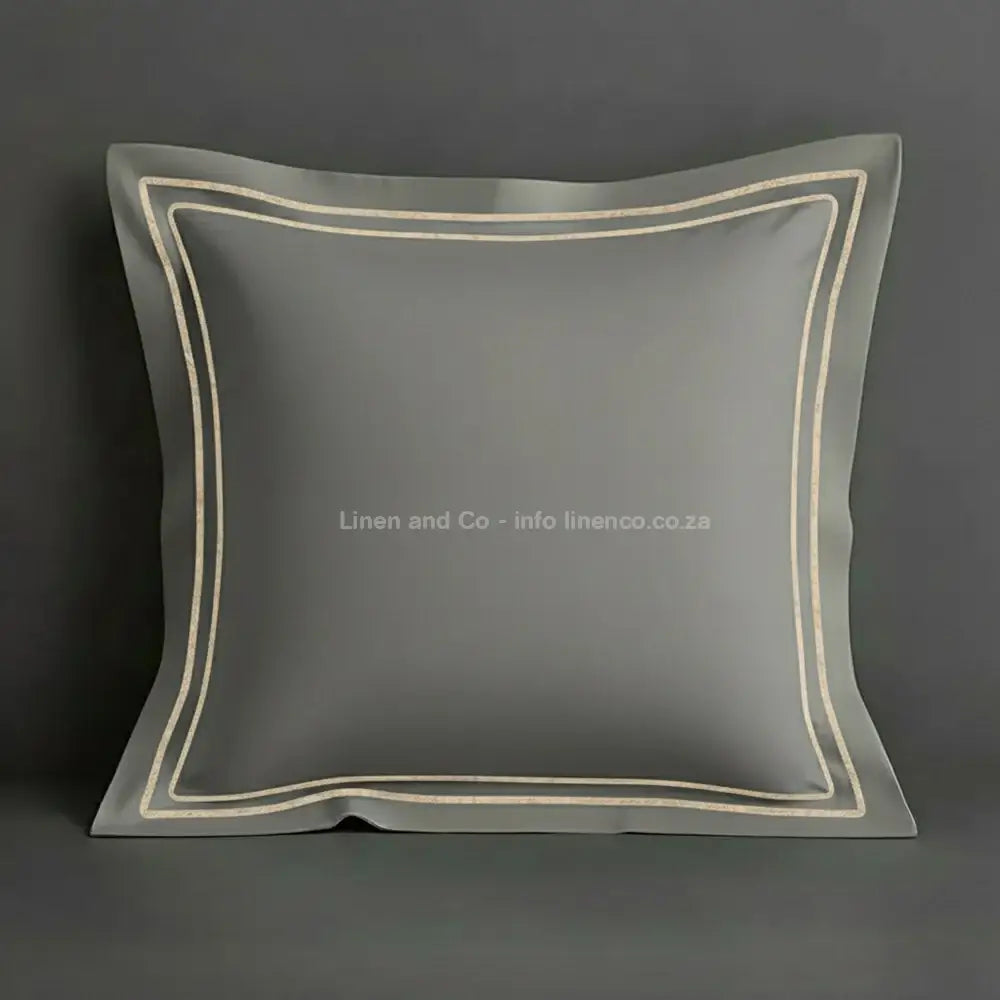 Grey continental oxford pillow case with stone two row satin stitch detail on a grey background. Luxury Hotel Linen by Linen and Co.