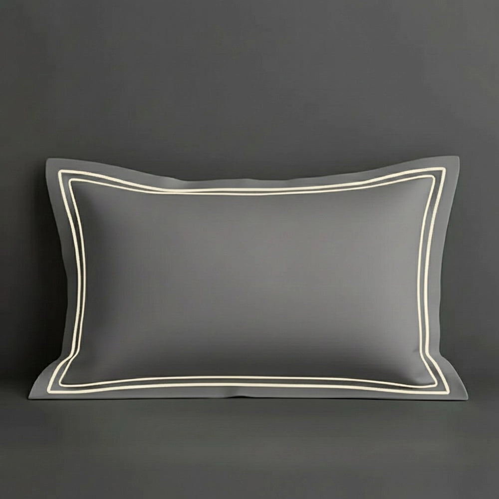 Grey oxford pillow case with two row satin stitch detail on a grey background. Luxury Hotel Linen by Linen and Co.
