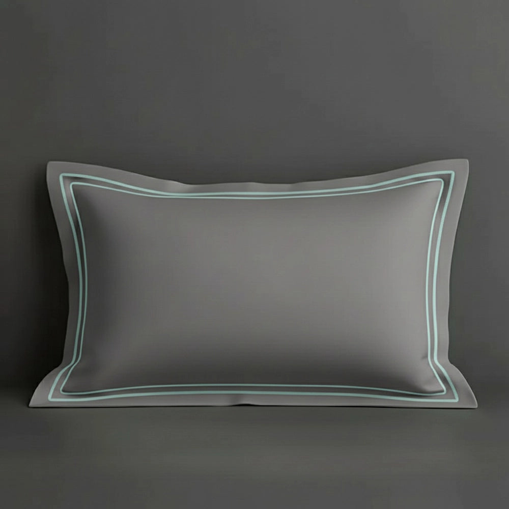 Grey oxford pillow case with two row satin stitch detail on a grey background. Luxury Hotel Linen by Linen and Co.