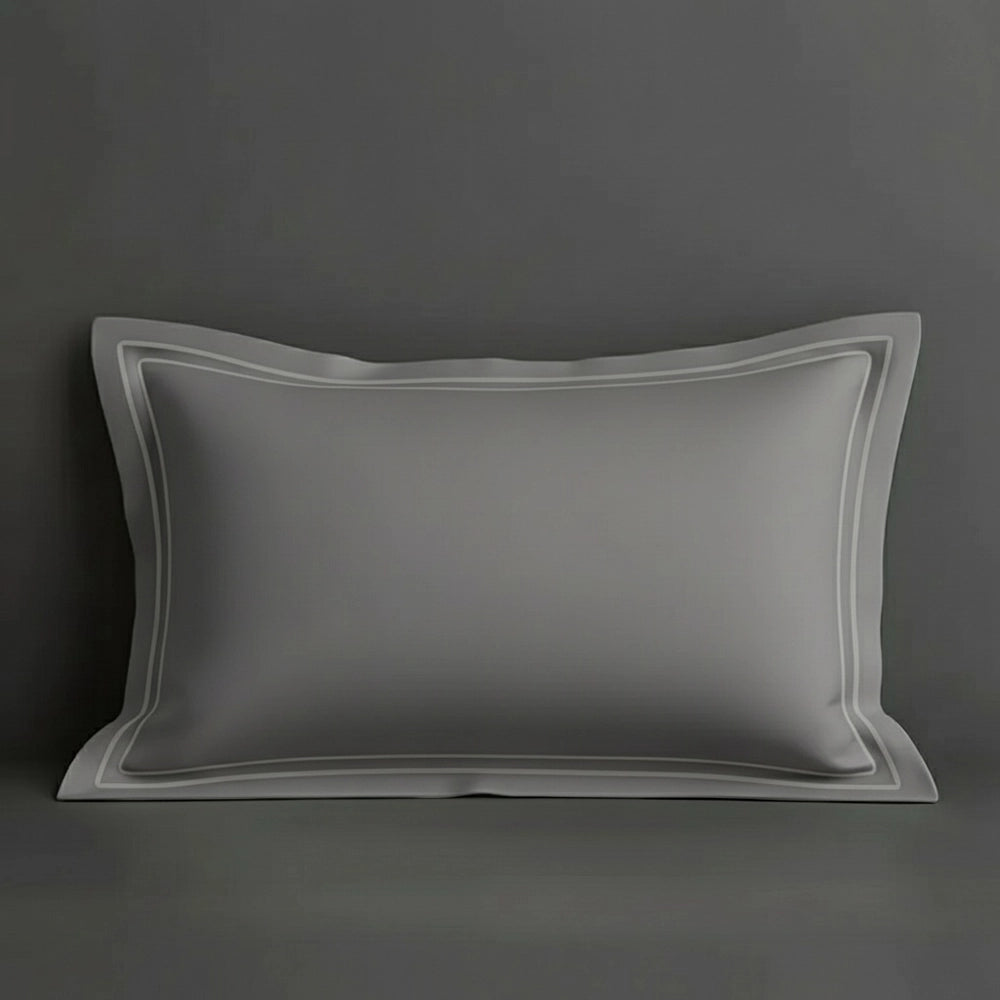 Grey oxford pillow case with two row satin stitch detail on a grey background. Luxury Hotel Linen by Linen and Co.