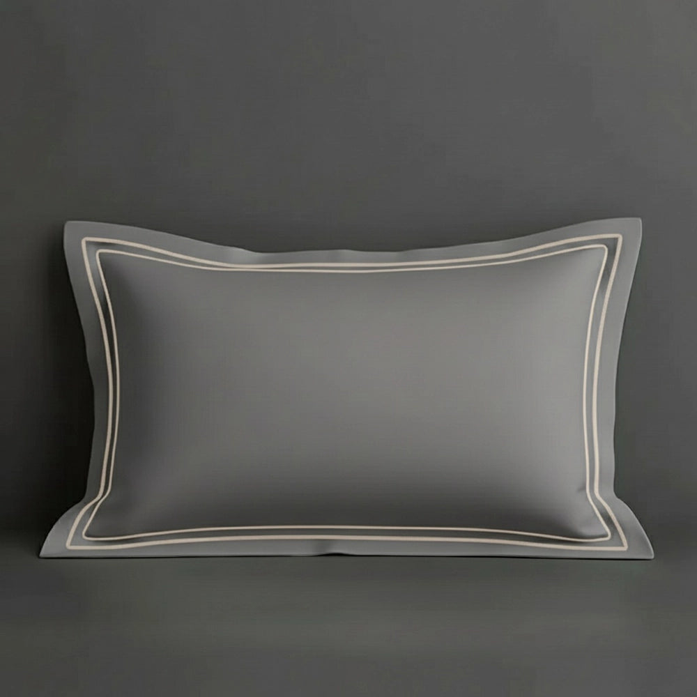 Grey oxford pillow case with two row satin stitch detail on a grey background. Luxury Hotel Linen by Linen and Co.