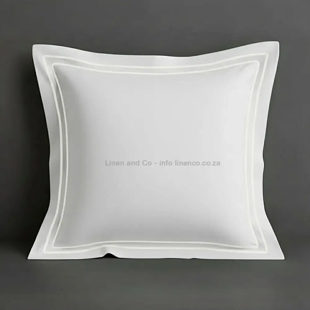 White continental oxford pillow case with white two row satin stitch detail on a grey background. Luxury Hotel Linen by Linen and Co.