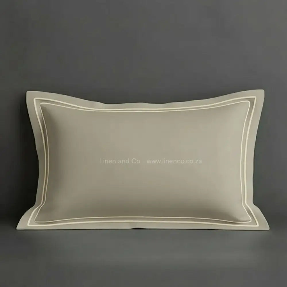 Stone oxford pillow case with cream two row satin stitch detail on a grey background. Luxury Hotel Linen by Linen and Co.