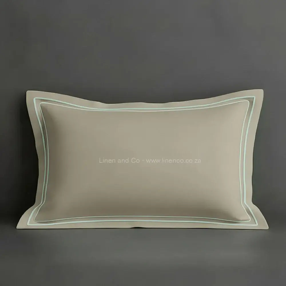 Stone oxford pillow case with duck egg two row satin stitch detail on a grey background. Luxury Hotel Linen by Linen and Co.