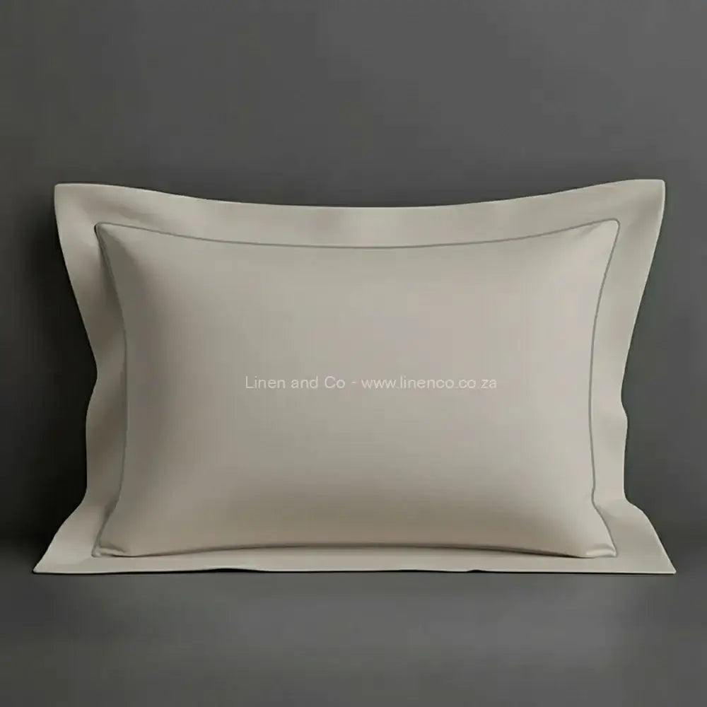 Stone oxford pillow case with grey one row satin stitch detail on a grey background. Luxury Hotel Linen by Linen and Co.