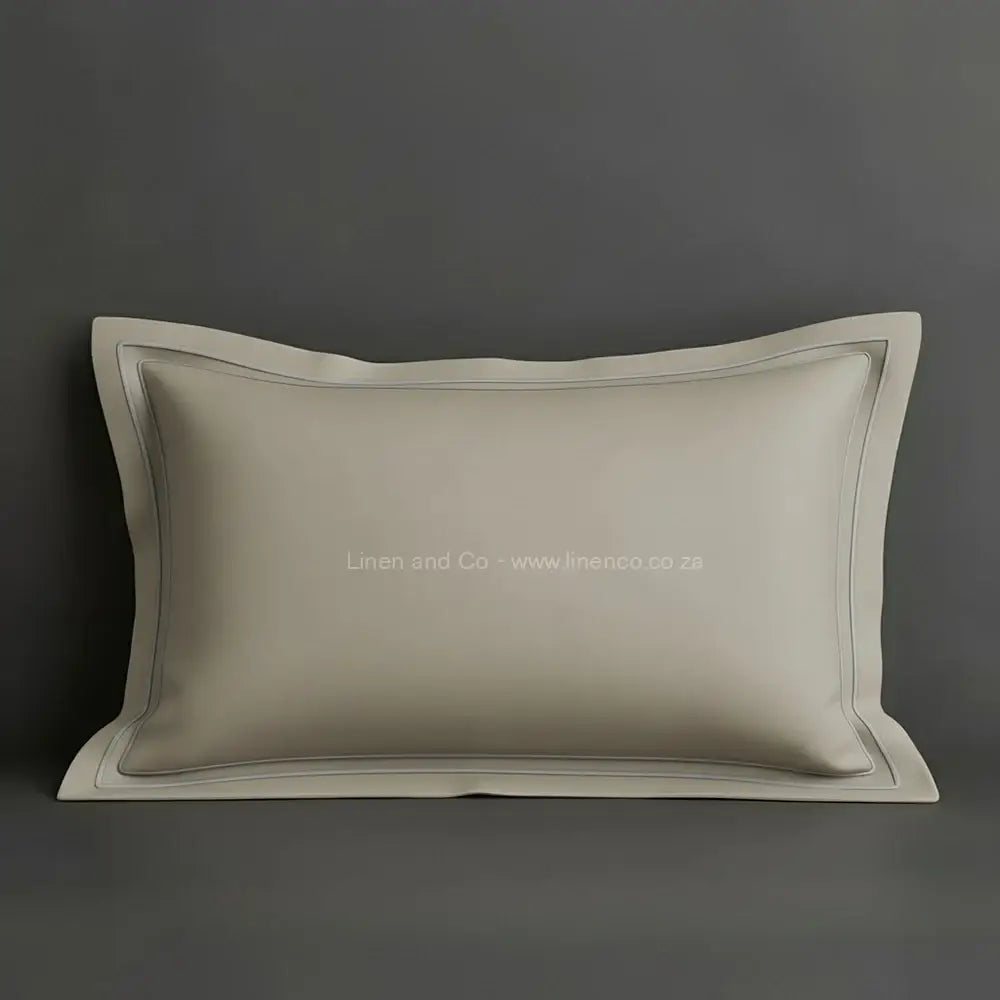Stone oxford pillow case with grey two row satin stitch detail on a grey background. Luxury Hotel Linen by Linen and Co.