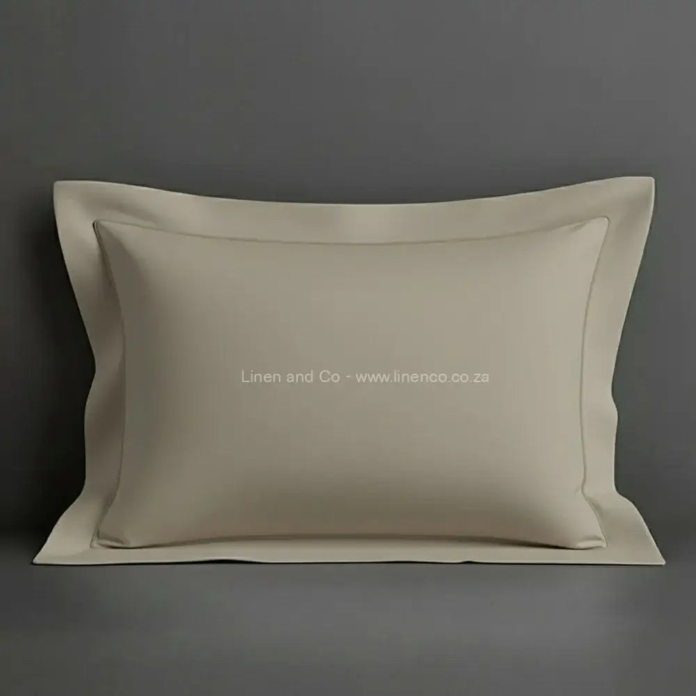 Stone oxford pillow case with stone one row satin stitch detail on a grey background. Luxury Hotel Linen by Linen and Co.