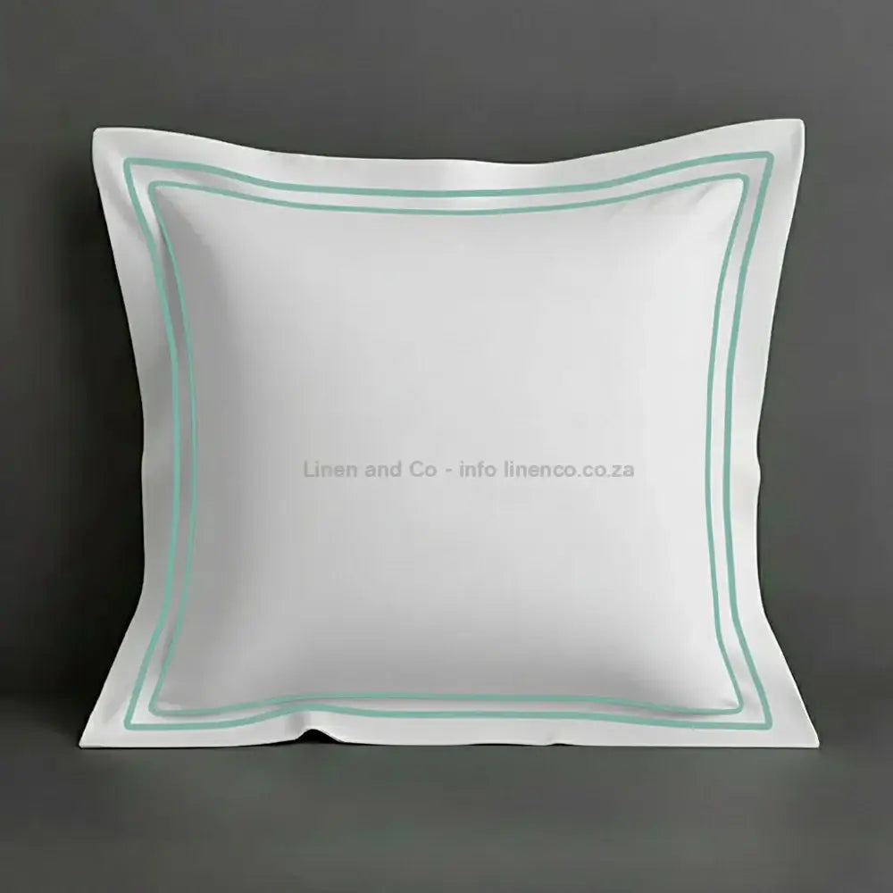 White continental oxford pillow case with duck egg two row satin stitch detail on a grey background. Luxury Hotel Linen by Linen and Co.