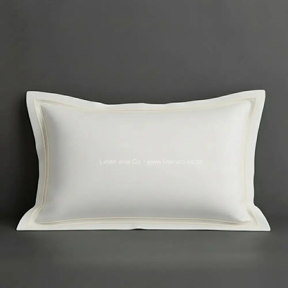 White oxford pillow case with cream two row satin stitch detail on a grey background. Luxury Hotel Linen by Linen and Co.