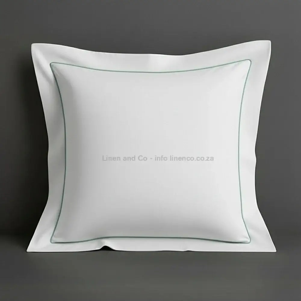 White continental oxford pillow case with duck egg one row satin stitch detail on a grey background. Luxury Hotel Linen by Linen and Co.