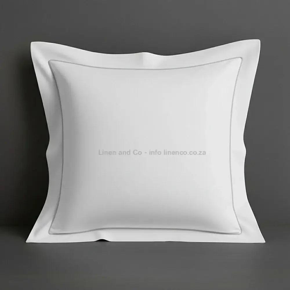 White continental oxford pillow case with grey one row satin stitch detail on a grey background. Luxury Hotel Linen by Linen and Co.