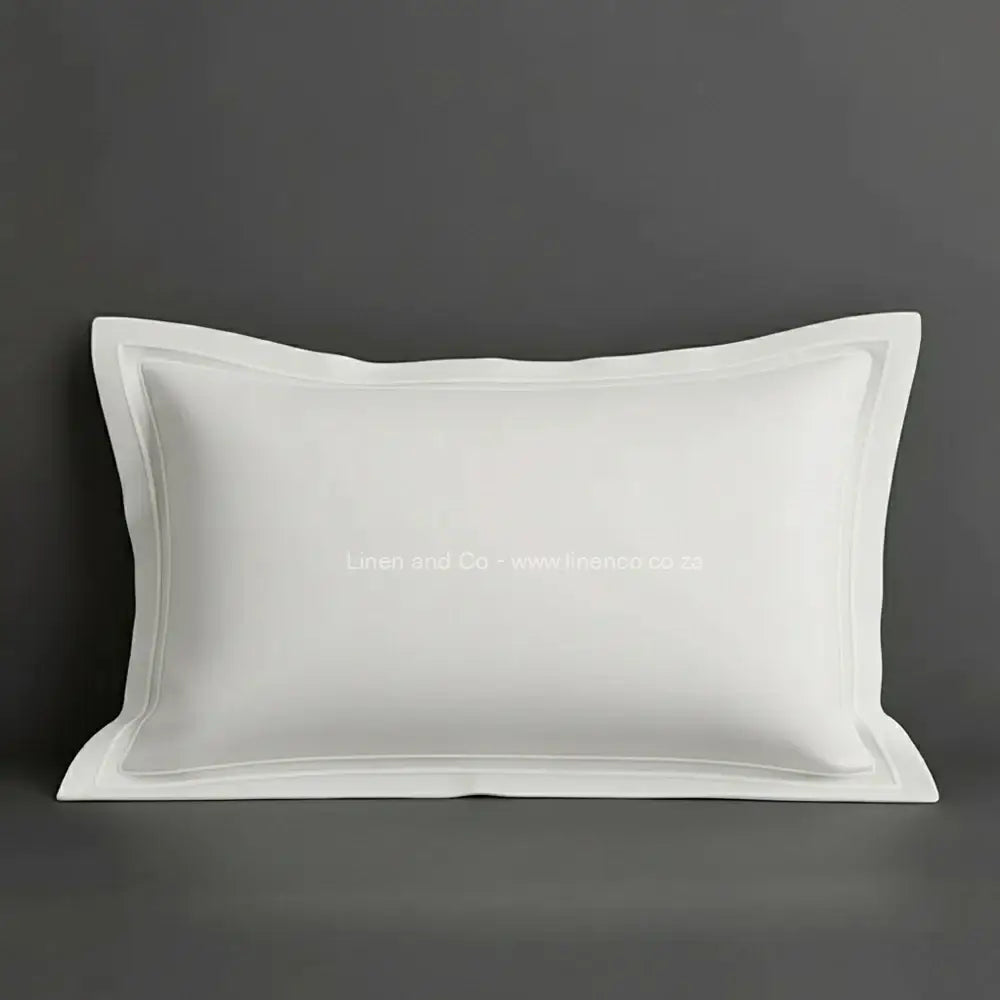 White oxford pillow case with white two row satin stitch detail on a grey background. Luxury Hotel Linen by Linen and Co.