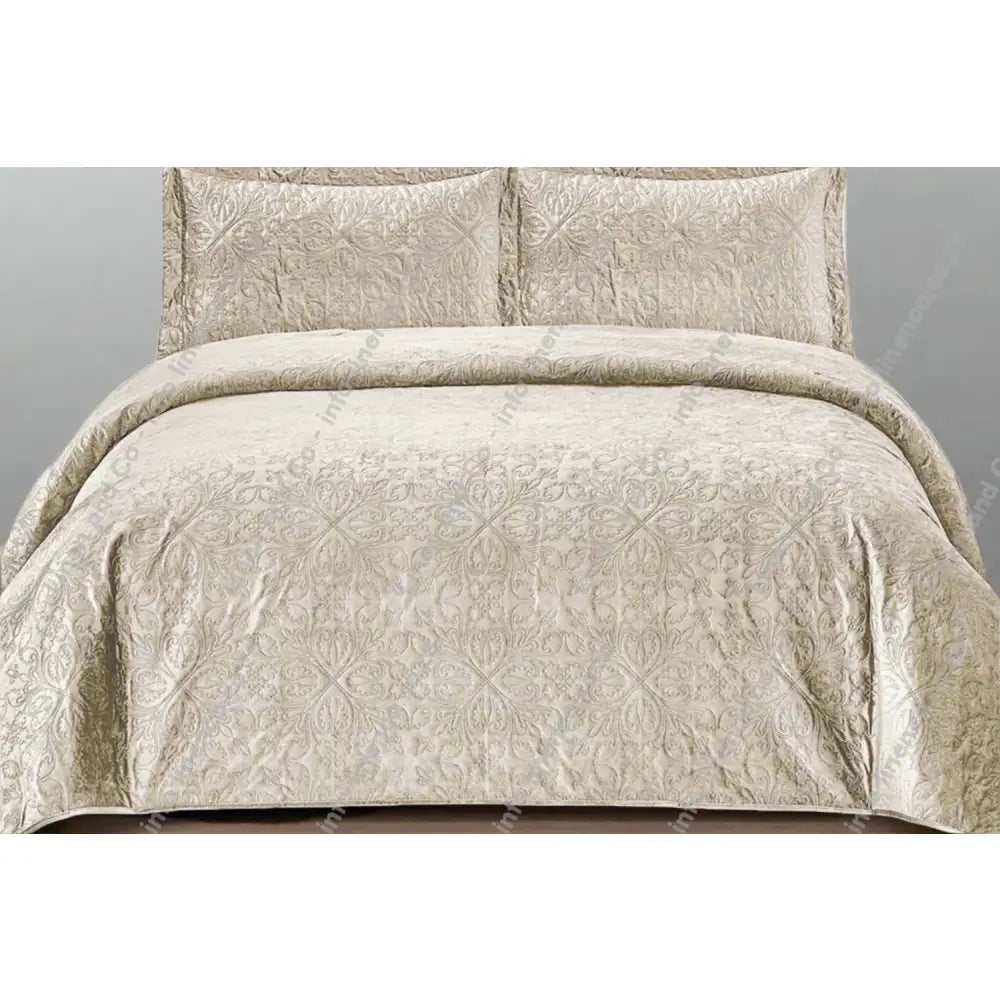 Stone French velvet quilted bedding set on a bed with matching pillows