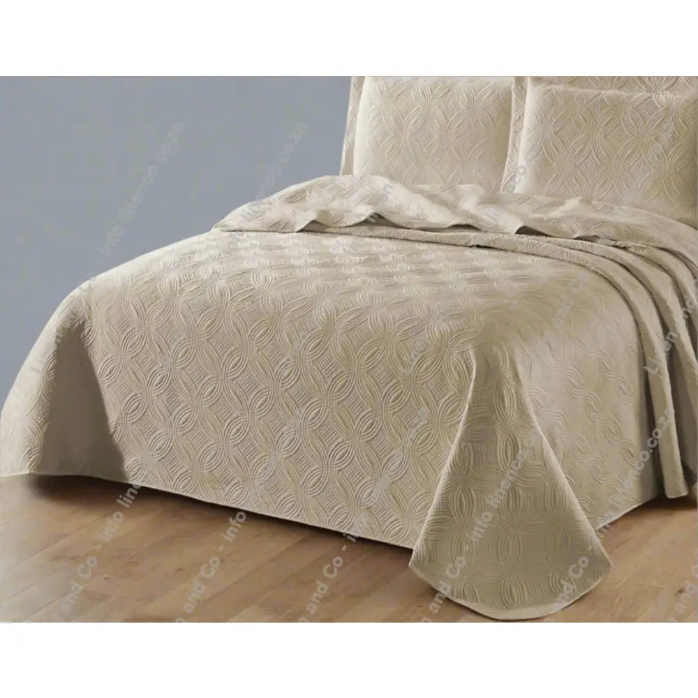 Stone Munich design quilted bedspread textured bedspread on a bed. 