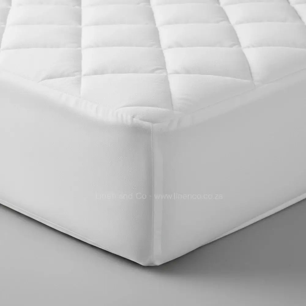 White quilted wetsafe mattress protector corner detail showing waterproof protection - Linen & Co