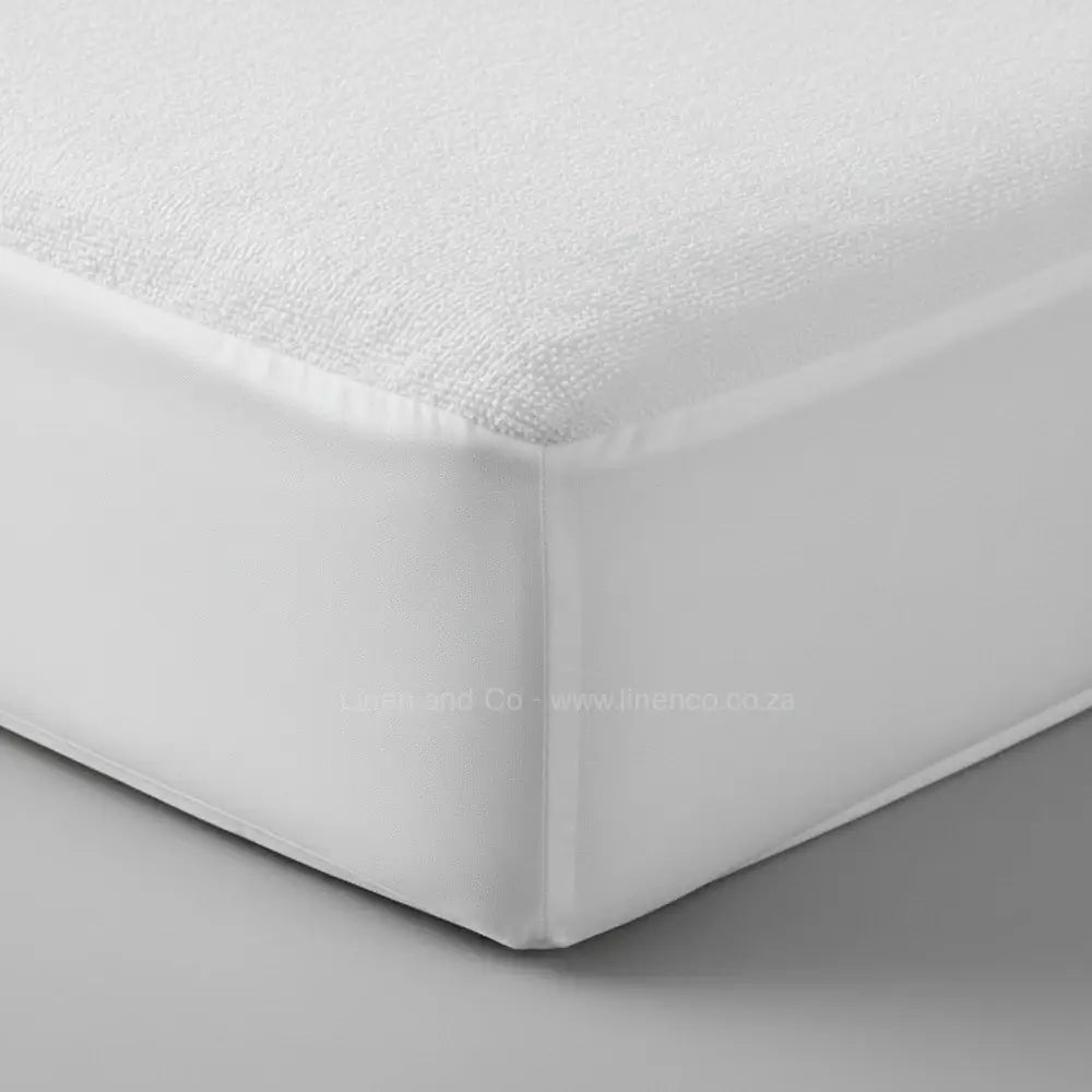 White terry towelling wetsafe mattress protector corner detail showing waterproof protection - Linen & Co