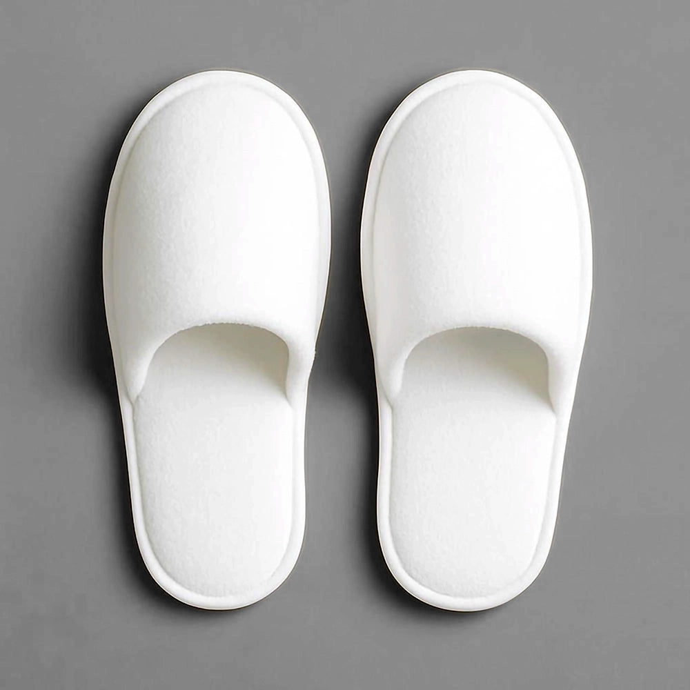 White closed-toe disposable slippers by Linen and Co - premium hospitality footwear