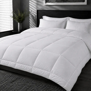 Bristol Sleep Luxury 320gsm white microfibre duvet inner with box stitching on a hotel bed – Linen and Co