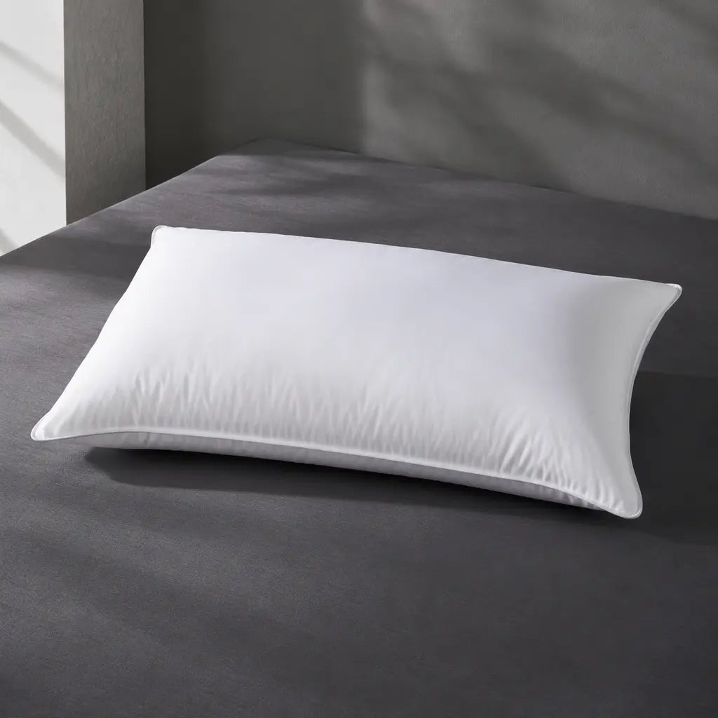 Bristol Sleep Luxury white microfibre pillow inner on a charcoal bed surface – Linen and Co