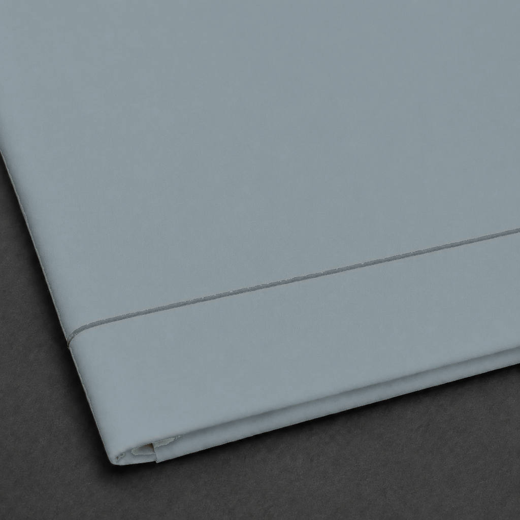 Duck Egg polycotton percale 200TC flat sheet with Grey one-row satin stitch — close-up detail.
