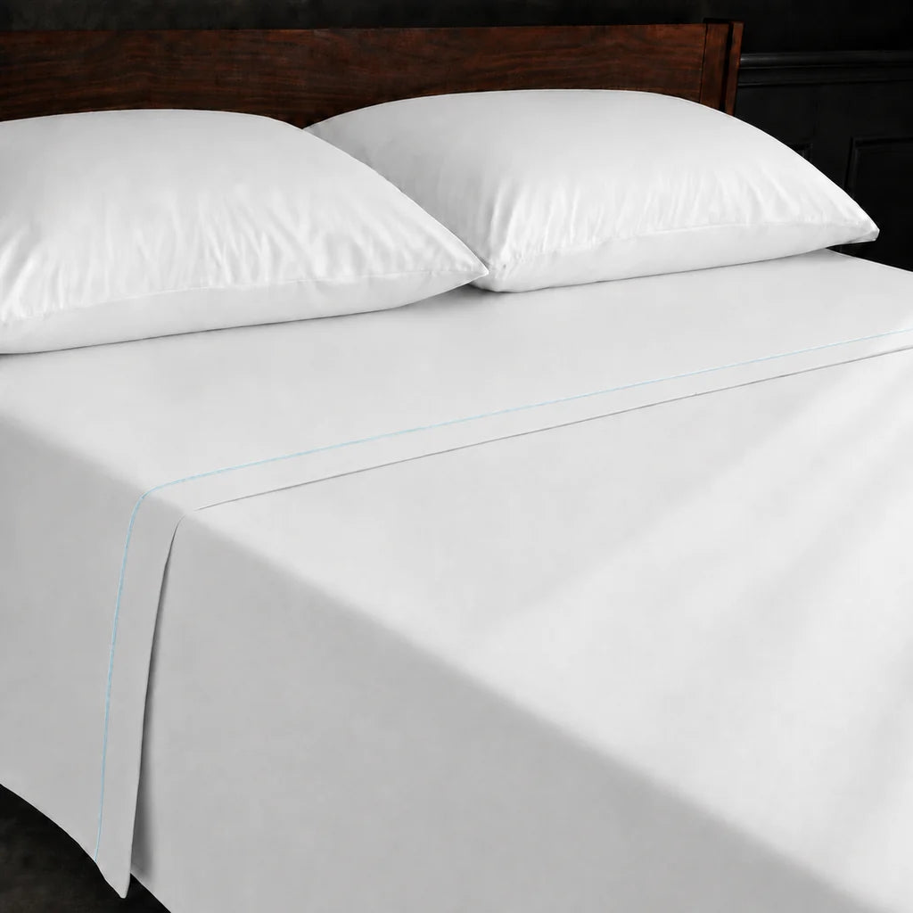 White Polycotton Percale 200TC flat sheet with Duck Egg one row satin stitch - on the bed - Linen and Co
