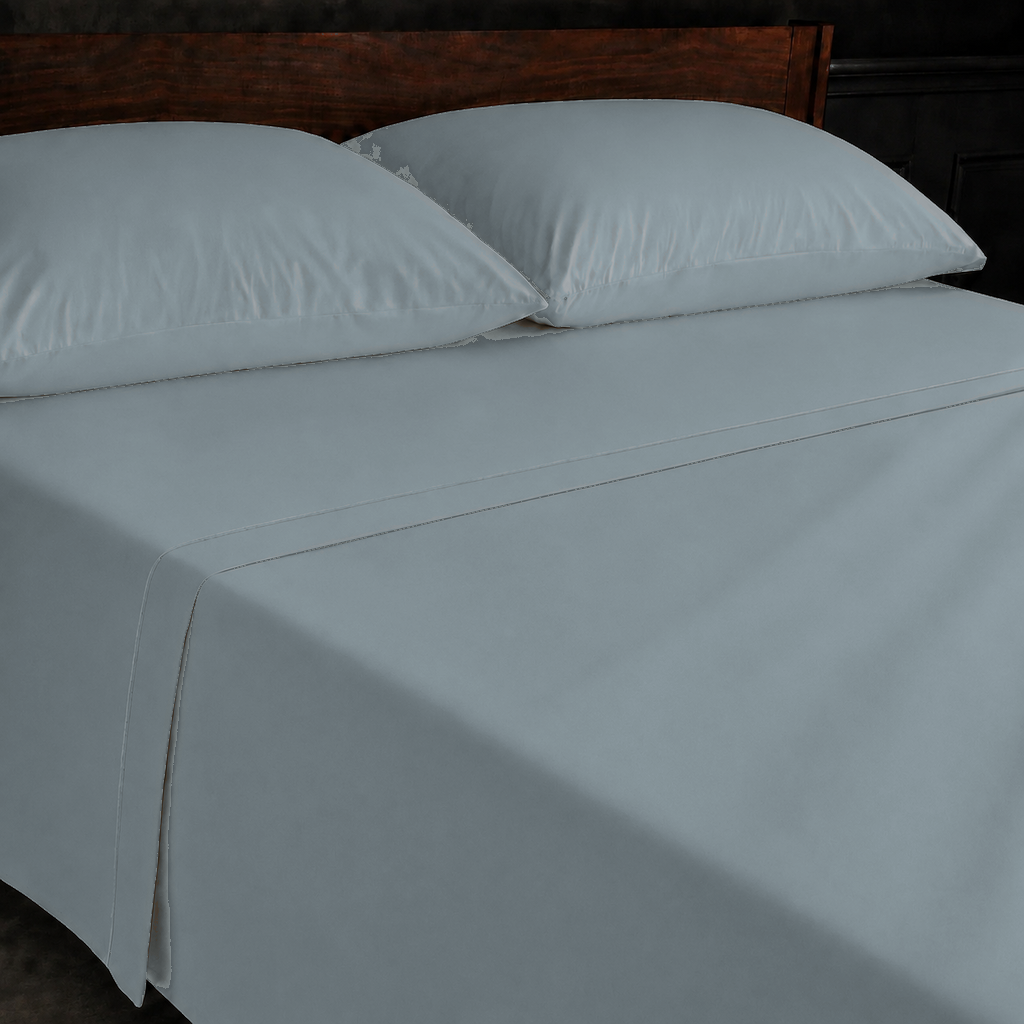 Duck Egg polycotton percale 200TC flat sheet with Duck Egg one-row satin stitch — on the bed.