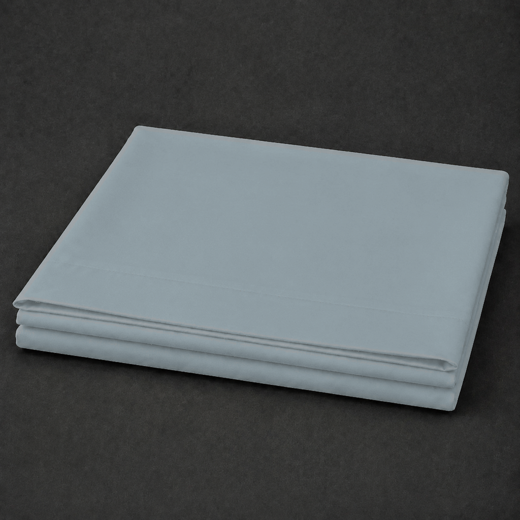 Duck Egg polycotton percale 200TC flat sheet, plain — on the bed.