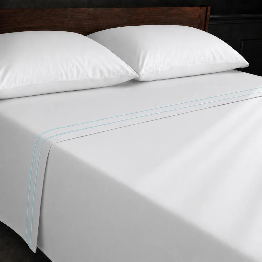 White Polycotton Percale 200TC flat sheet with Duck Egg two row satin stitch - on the bed - Linen and Co