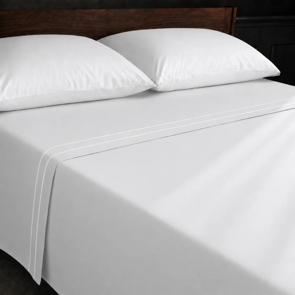 White Polycotton Percale 200TC flat sheet with White two row satin stitch - on the bed - Linen and Co