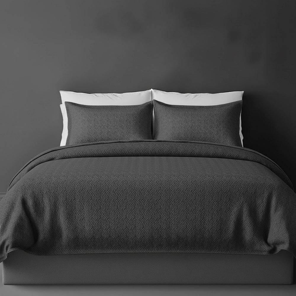 Charcoal Grey Istanbul bedspread on bed by Linen and Co - luxury hospitality bedspread with textured finish