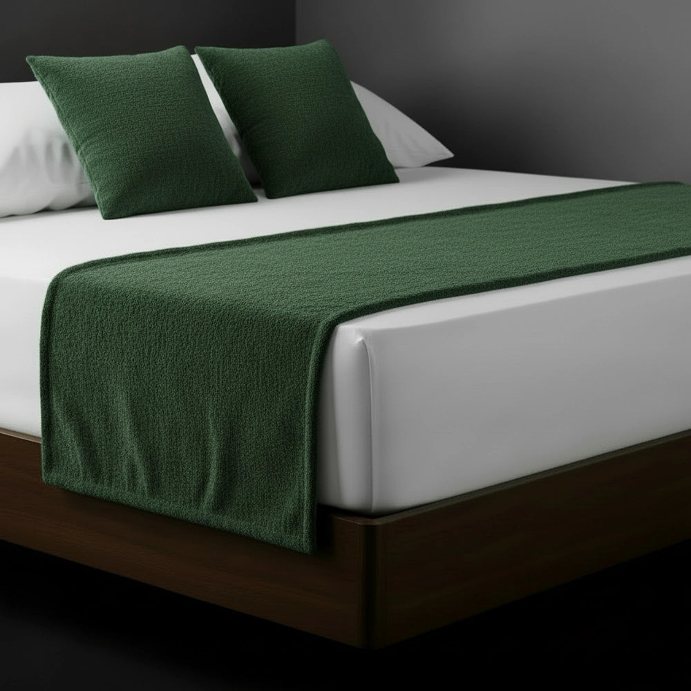 Green chenille bed runner and cushions on white bed by Linen and Co - luxury hospitality bedding