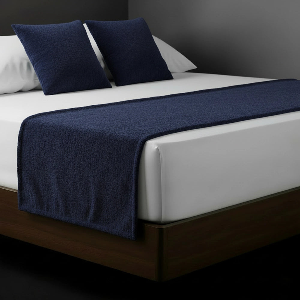 Navy Blue chenille bed runner and cushions on white bed by Linen and Co - luxury hospitality bedding