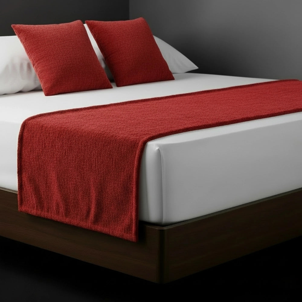 Red chenille bed runner and cushions on white bed by Linen and Co - luxury hospitality bedding