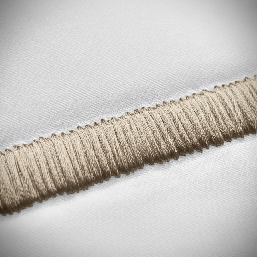 Close-up of stone satin stitch detail on white percale by Linen and Co 