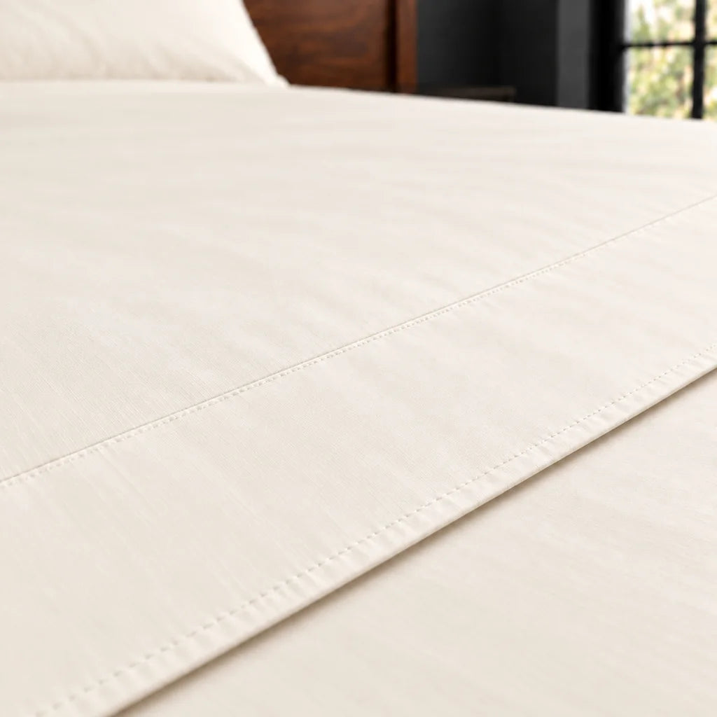 cream cotton percale 200tc flat sheet, plain no satin stitch — close up — Linen and Co