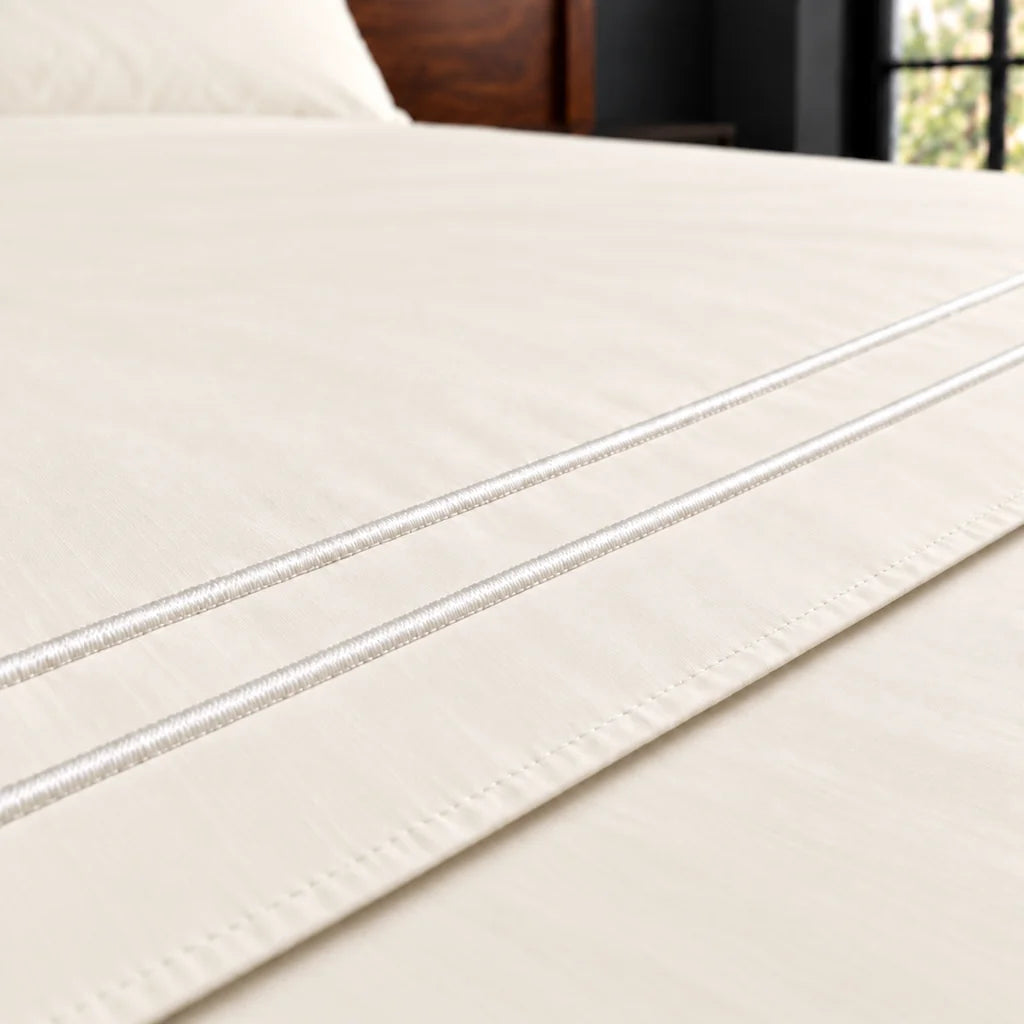 cream cotton percale 200tc flat sheet, two row white satin stitch — close up — Linen and Co