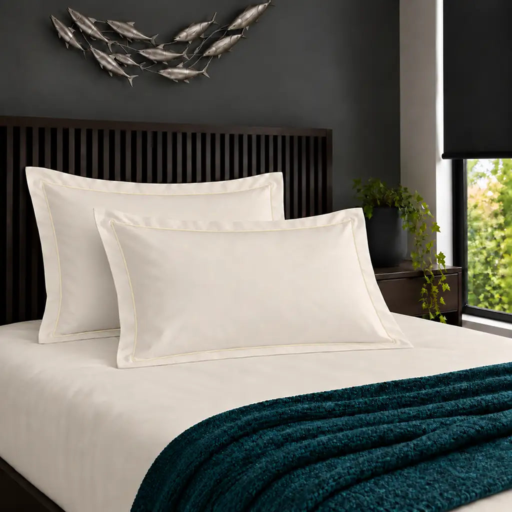 Oxford cream 200TC cotton percale pillowcases with one row cream satin stitch border by Linen and Co