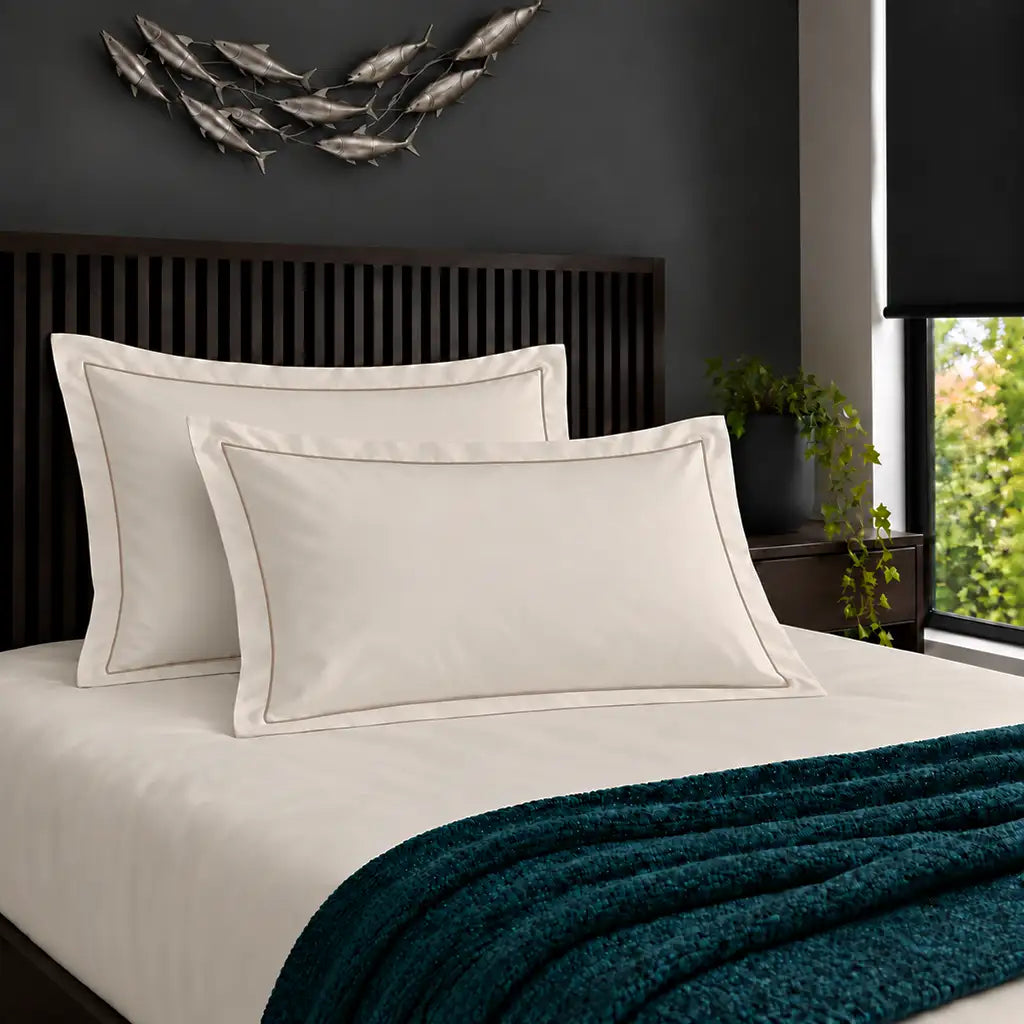 Oxford cream 200TC cotton percale pillowcases with one row stone satin stitch border by Linen and Co